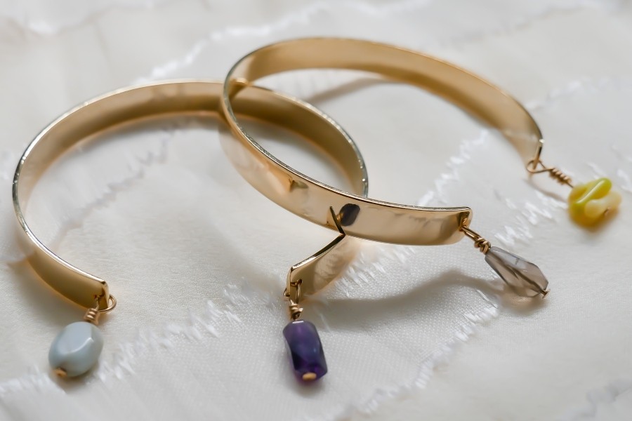two copper coloured bracelets